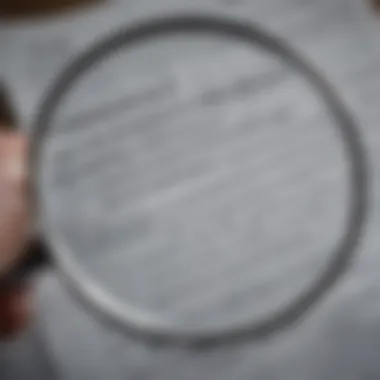 Close-up of a magnifying glass over financial documents