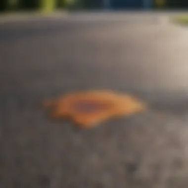 Close-up of oil stain on driveway surface