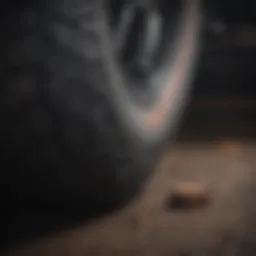Close-up view of a penny being placed in tire tread