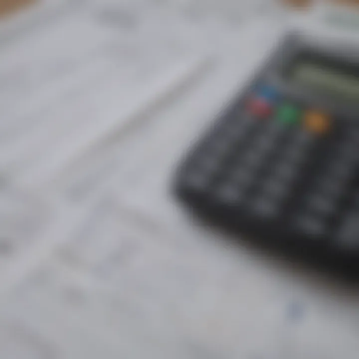 A close-up of insurance documents and a calculator symbolizing financial planning.