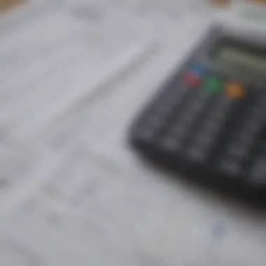 Insurance Documents and Financial Planning A close-up of insurance documents and a calculator symbolizing financial planning.