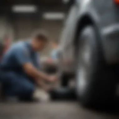 A professional mechanic assisting with tire repair