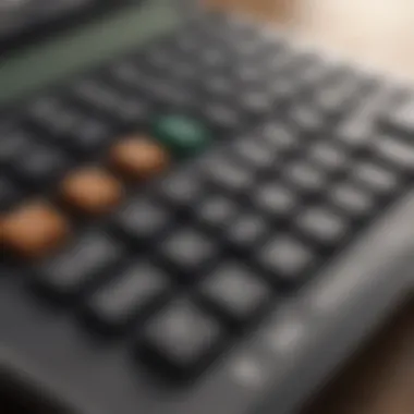 Close-up of a calculator with financial graphs