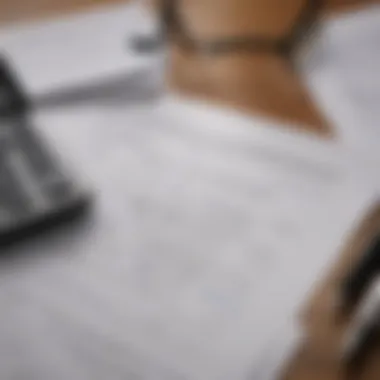 Insurance Documentation and Calculation A close-up of insurance documents with a calculator and a pen on a table