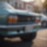 A close-up of a car's license plate being removed