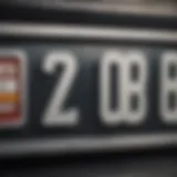 Close-up of a vehicle number plate highlighting registration details.